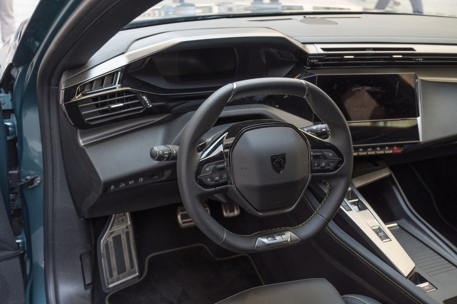 Modern sporty steering wheel with digital dashboard and center console