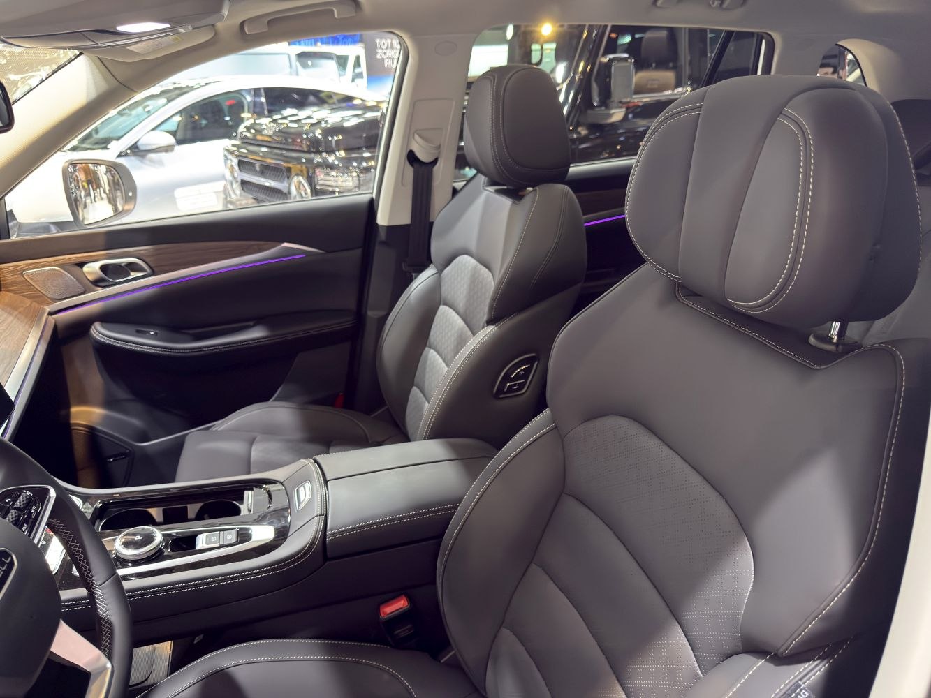Luxury front seat interior with leather upholstery and modern center console