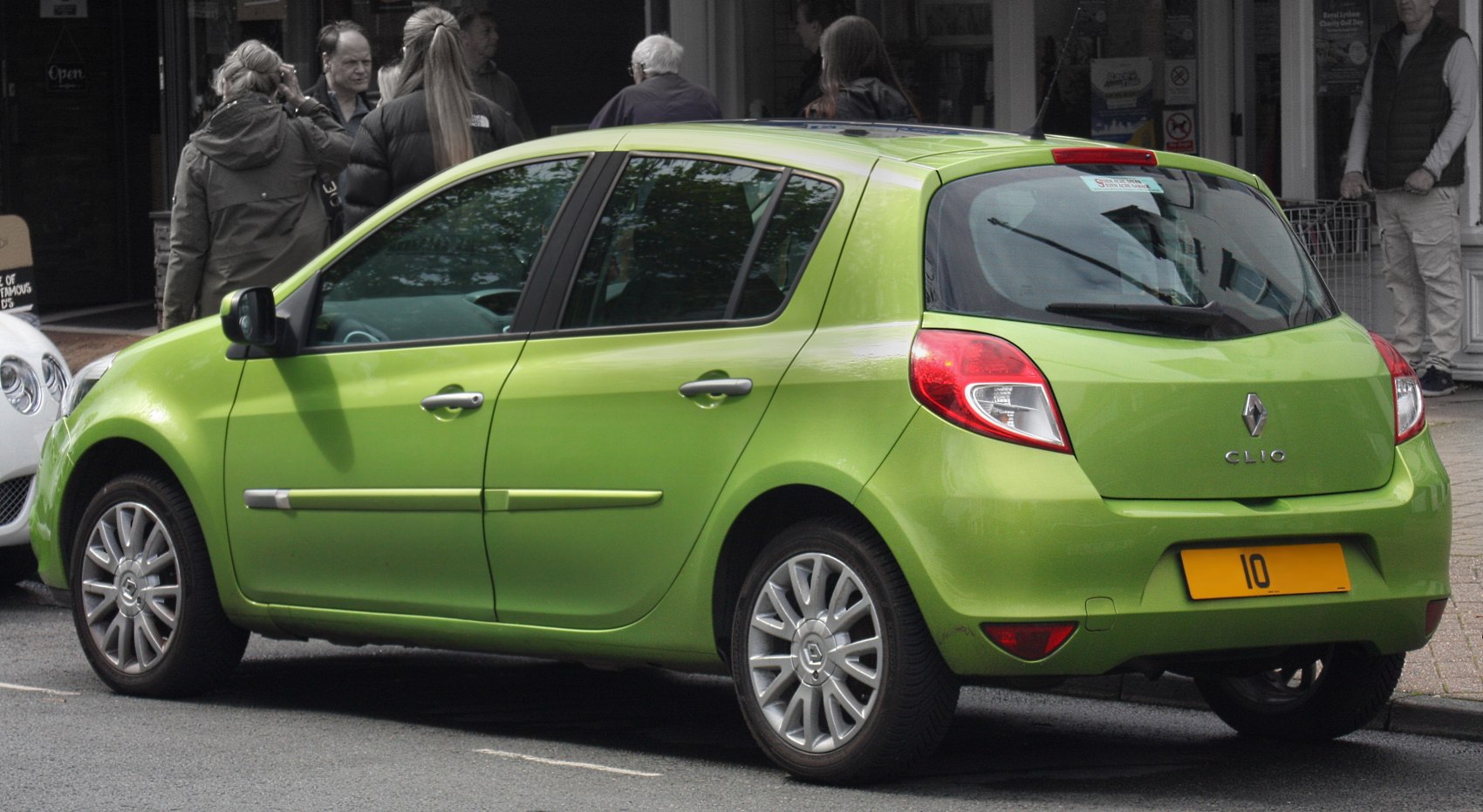 Green 5-door hatchback side profile with alloy wheels and rear light cluster