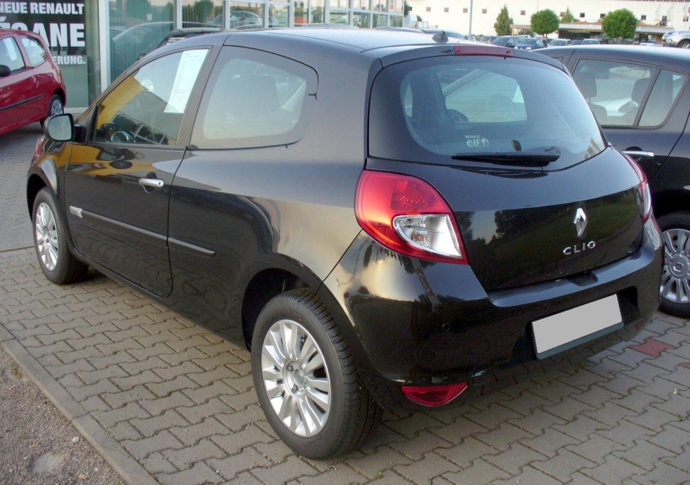 Rear and side view of a 3-door compact hatchback with unique windows and tail lights