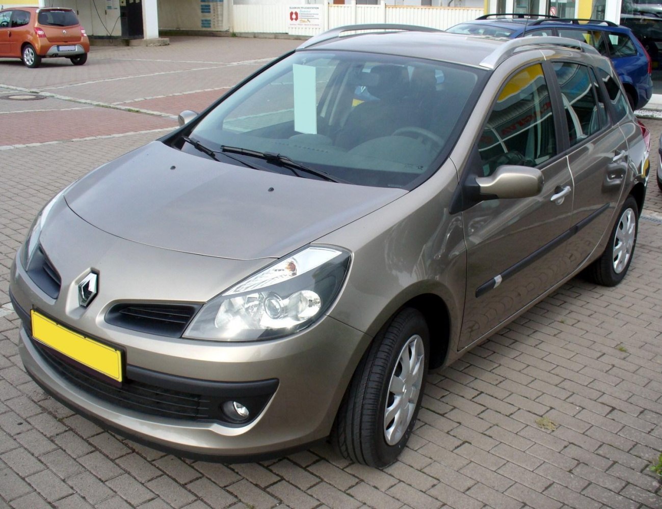 Compact hatchback with roof rails and front fog lights