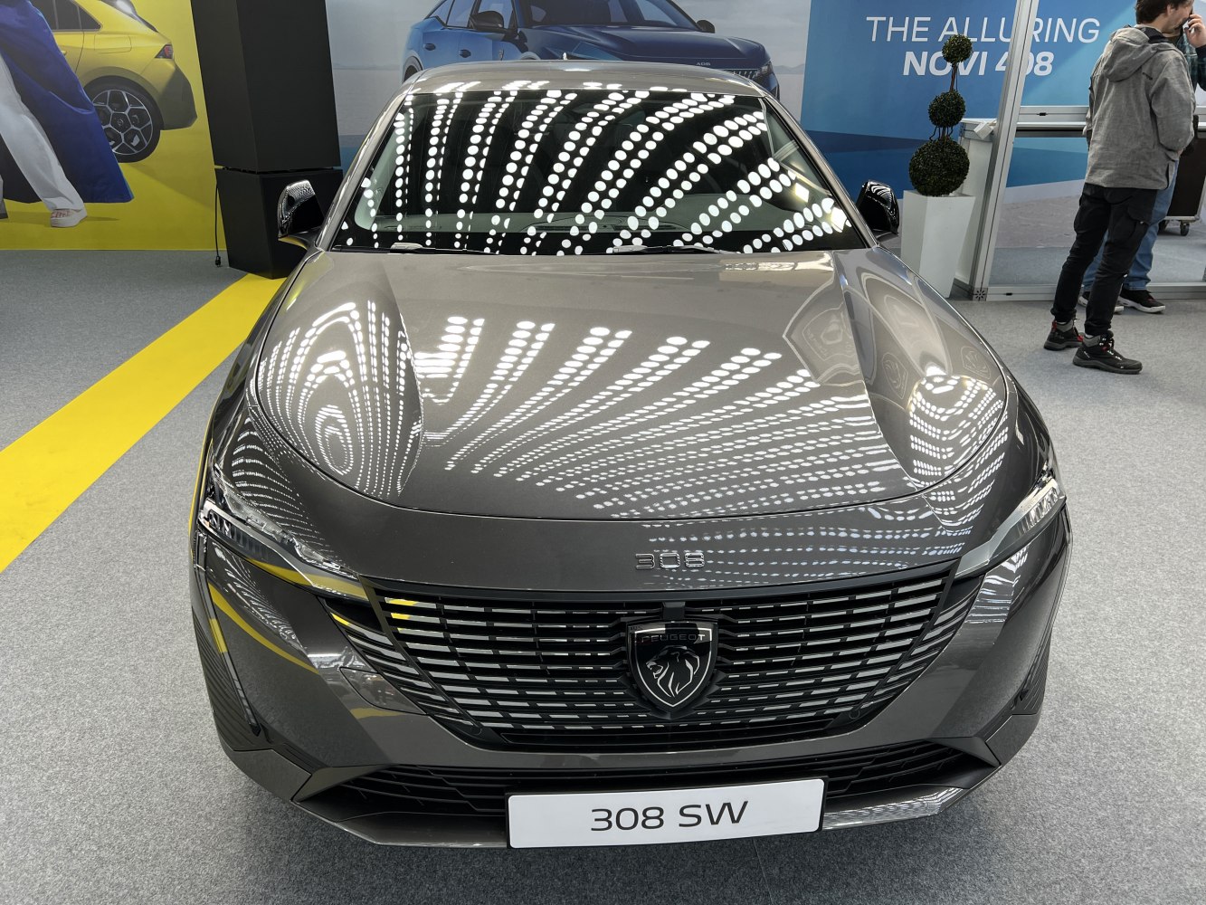 Front view with grille and modern headlights