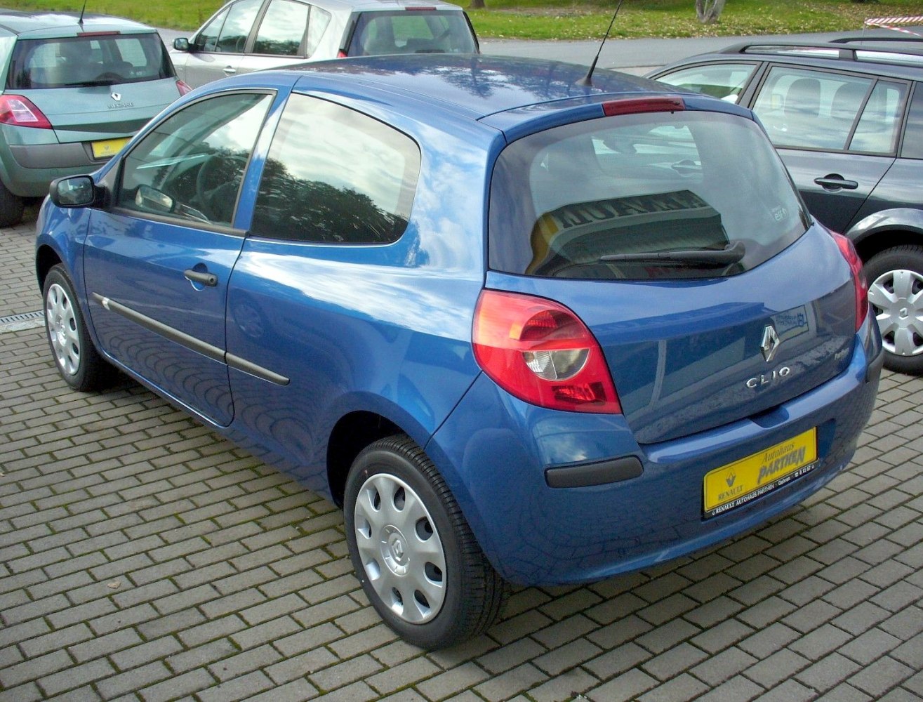Compact 3-door hatchback rear view with distinctive rear light cluster