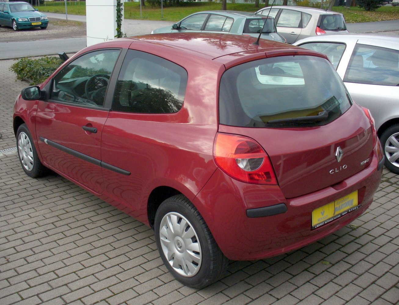 Compact red 3-door hatchback rear view with modern tail lights