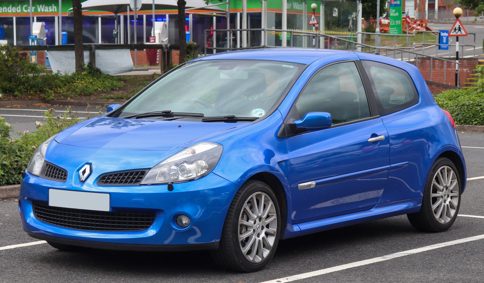 Front side view of a blue 3-door compact hatchback