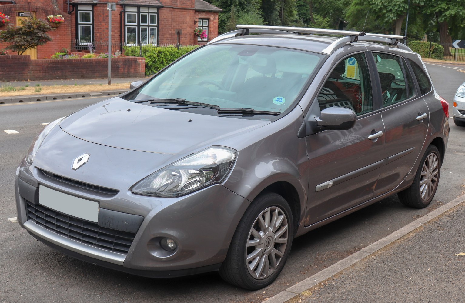 Compact hatchback with roof rails and alloy wheels