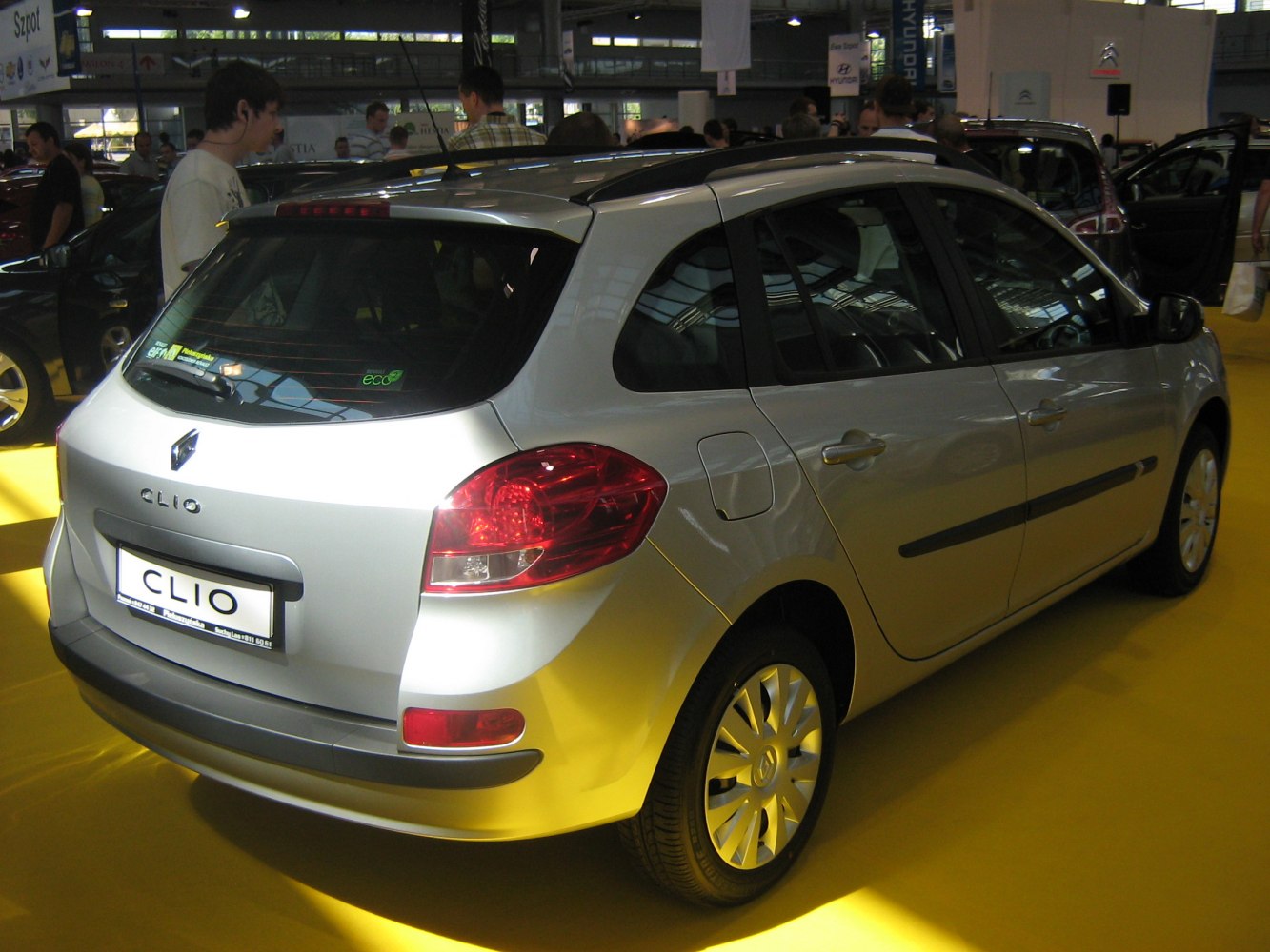 Silver compact hatchback rear-side with roof rails and taillights