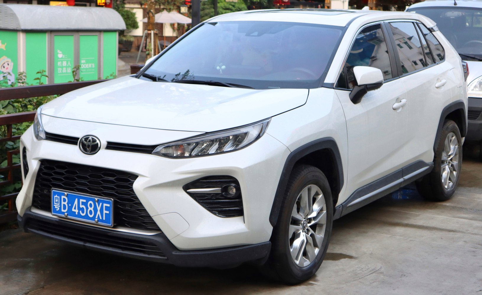Front and side view of modern SUV with distinctive headlights and grille