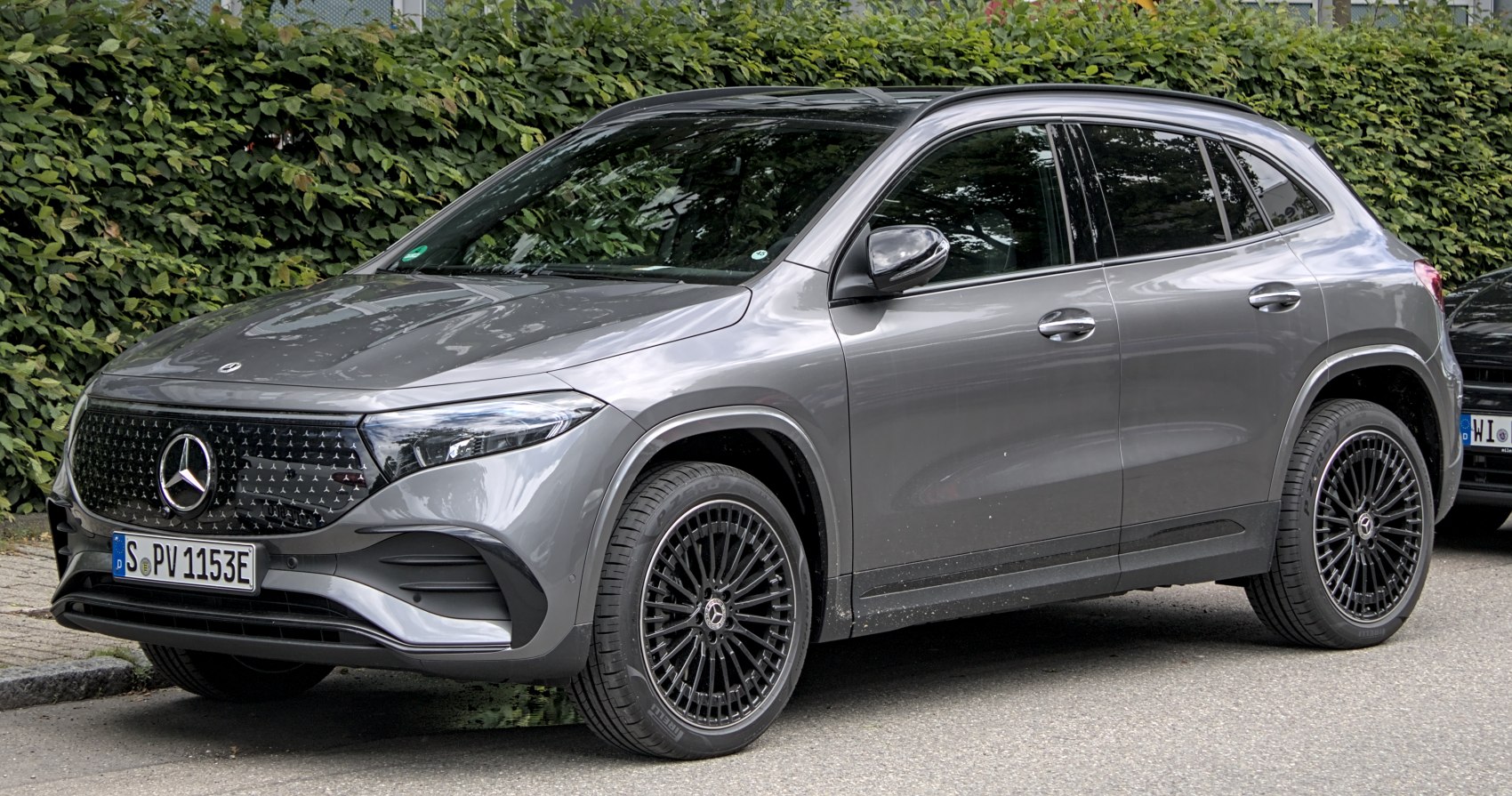 Front side view of electric SUV with aerodynamic design and alloy wheels