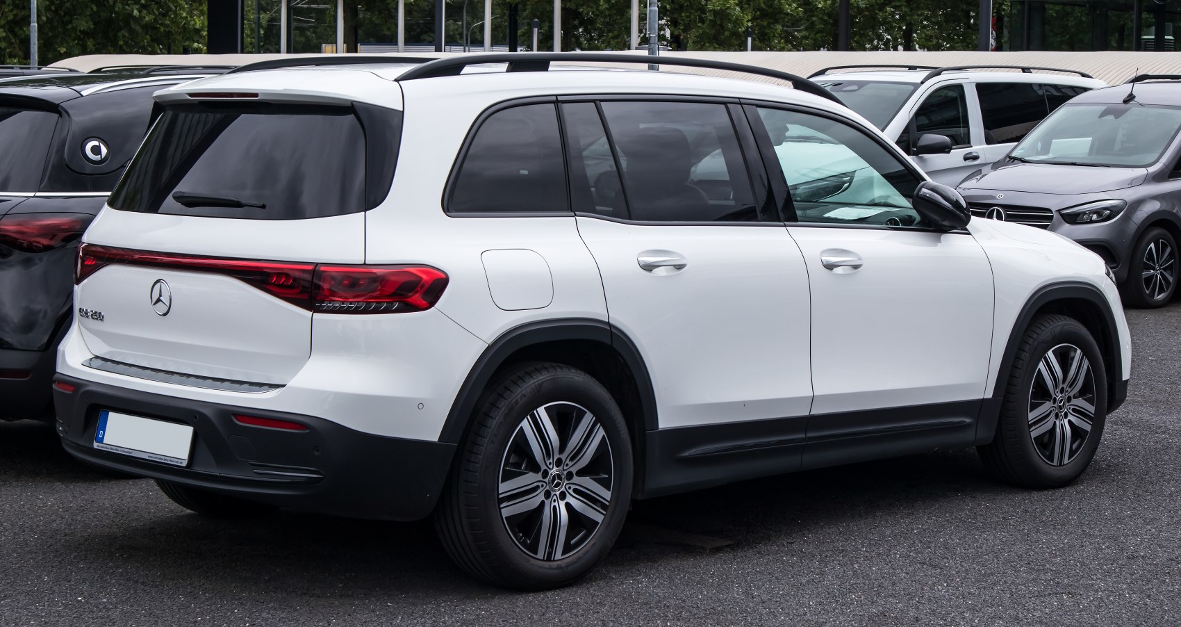 Rear and side view of a white electric SUV with LED taillights and alloy wheels