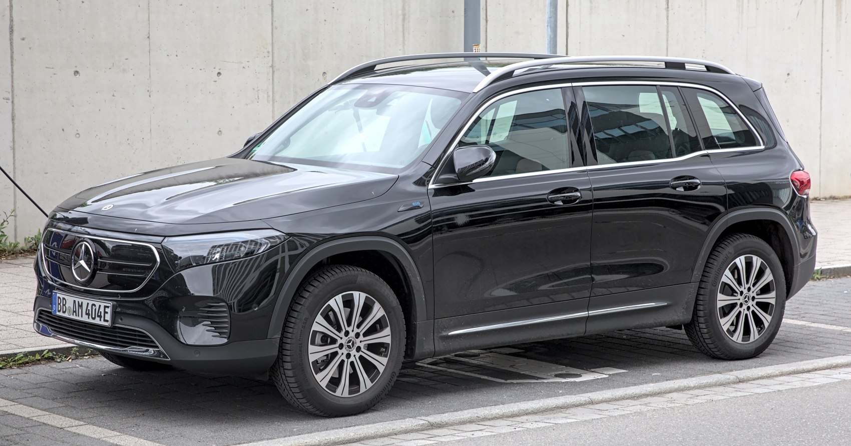 Black electric SUV with LED headlights and roof rails