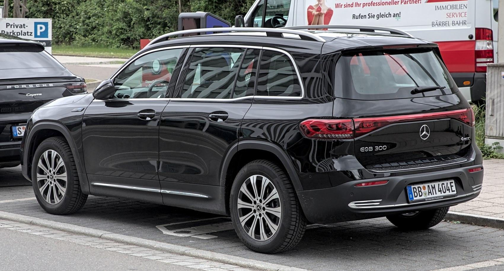 Rear view of electric SUV with LED tail lights and roof rails