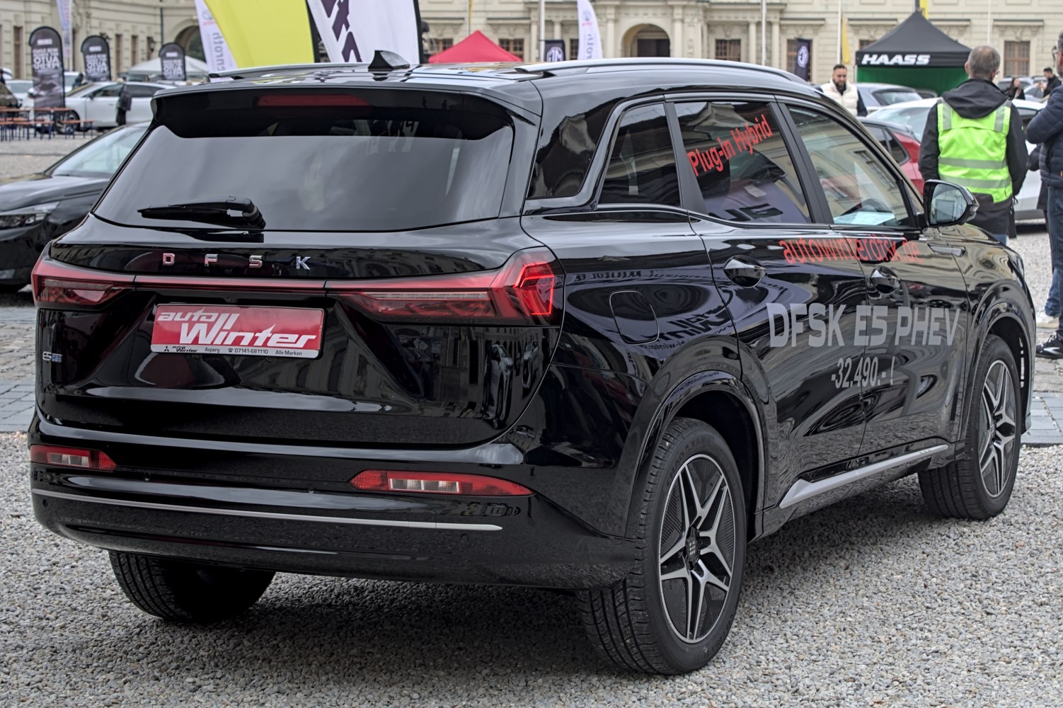 Rear view of black SUV with plug-in hybrid branding and sleek LED taillights