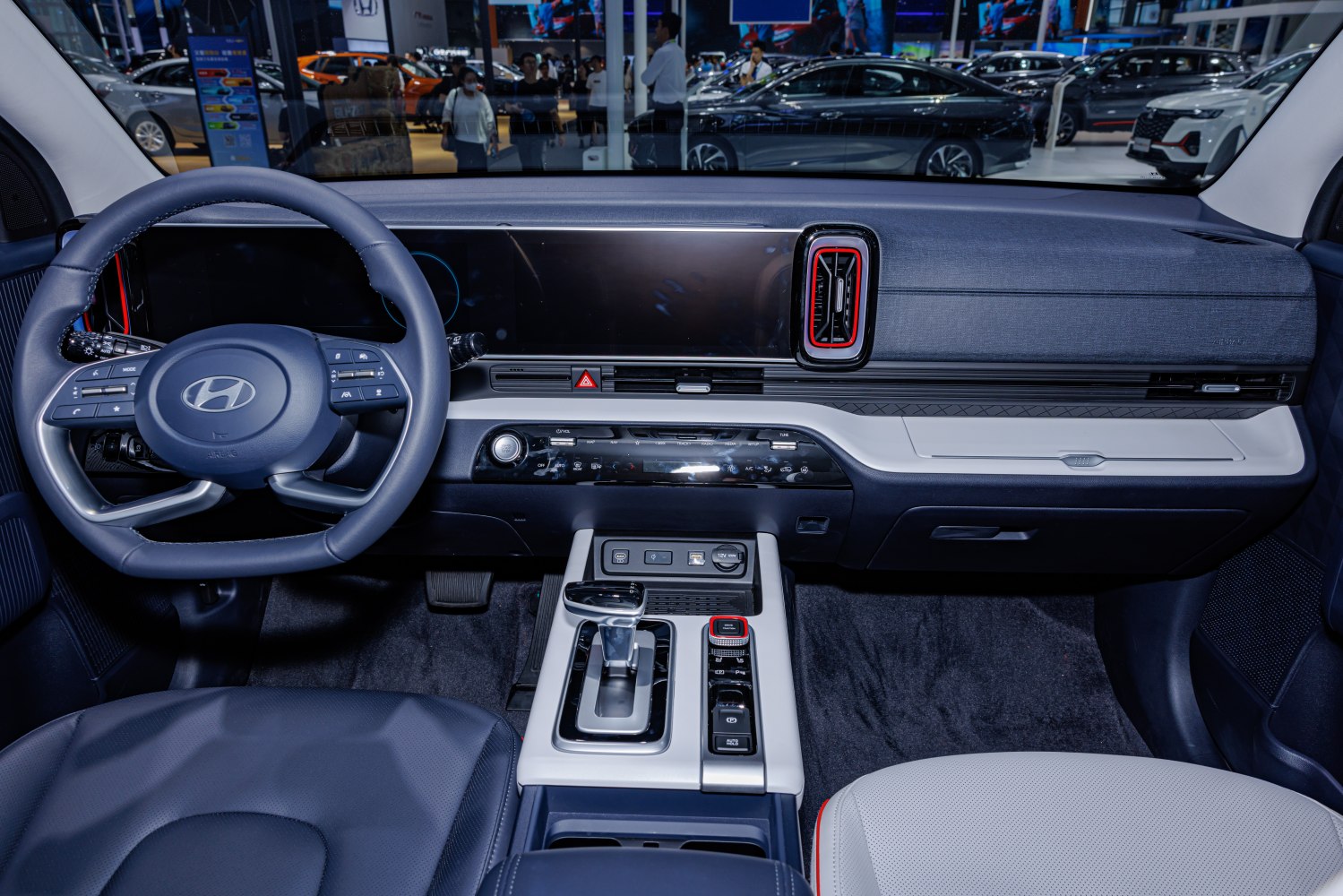 Digital dashboard, modern steering wheel, and advanced center console layout