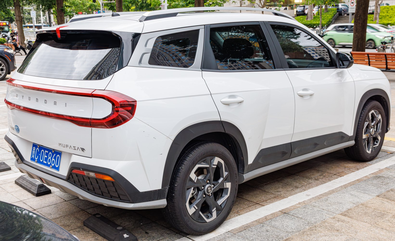Rear-side view of modern SUV with distinctive taillights and alloy wheels