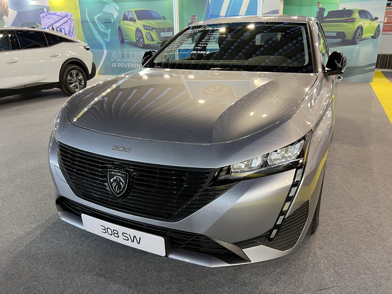 Modern compact wagon front with distinctive grille and LED headlights