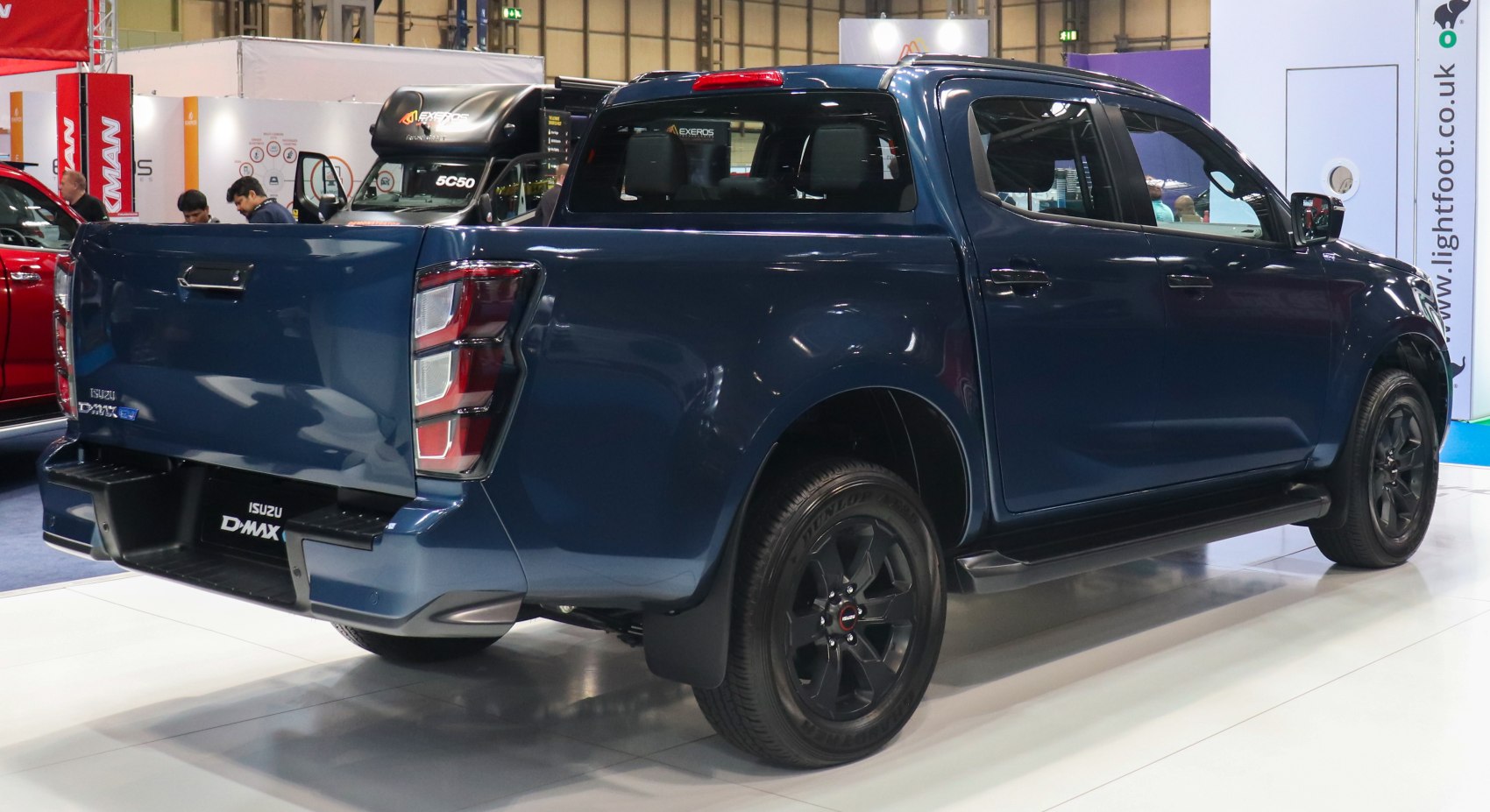 Rear and side view of a modern double cab pickup with distinctive taillights