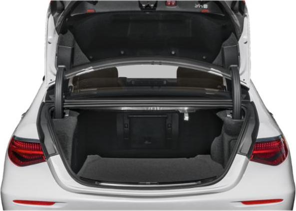 Open trunk of a luxury sedan with spacious interior and dual gas struts