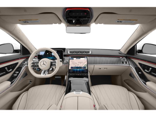 Luxury car interior with beige leather seats and advanced digital displays