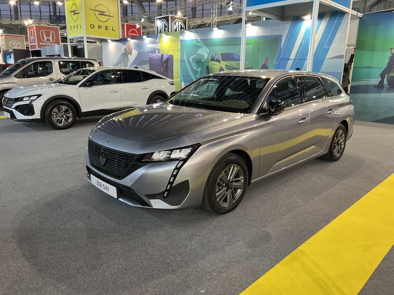 Silver station wagon with sleek LED headlights and dynamic front grille