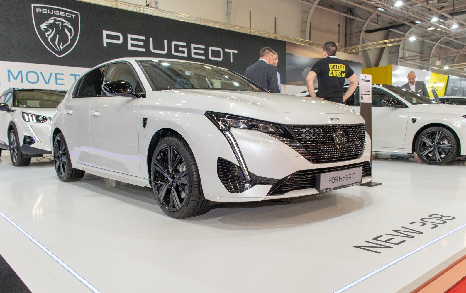 Front view of hybrid hatchback with distinctive grille and LED headlights.