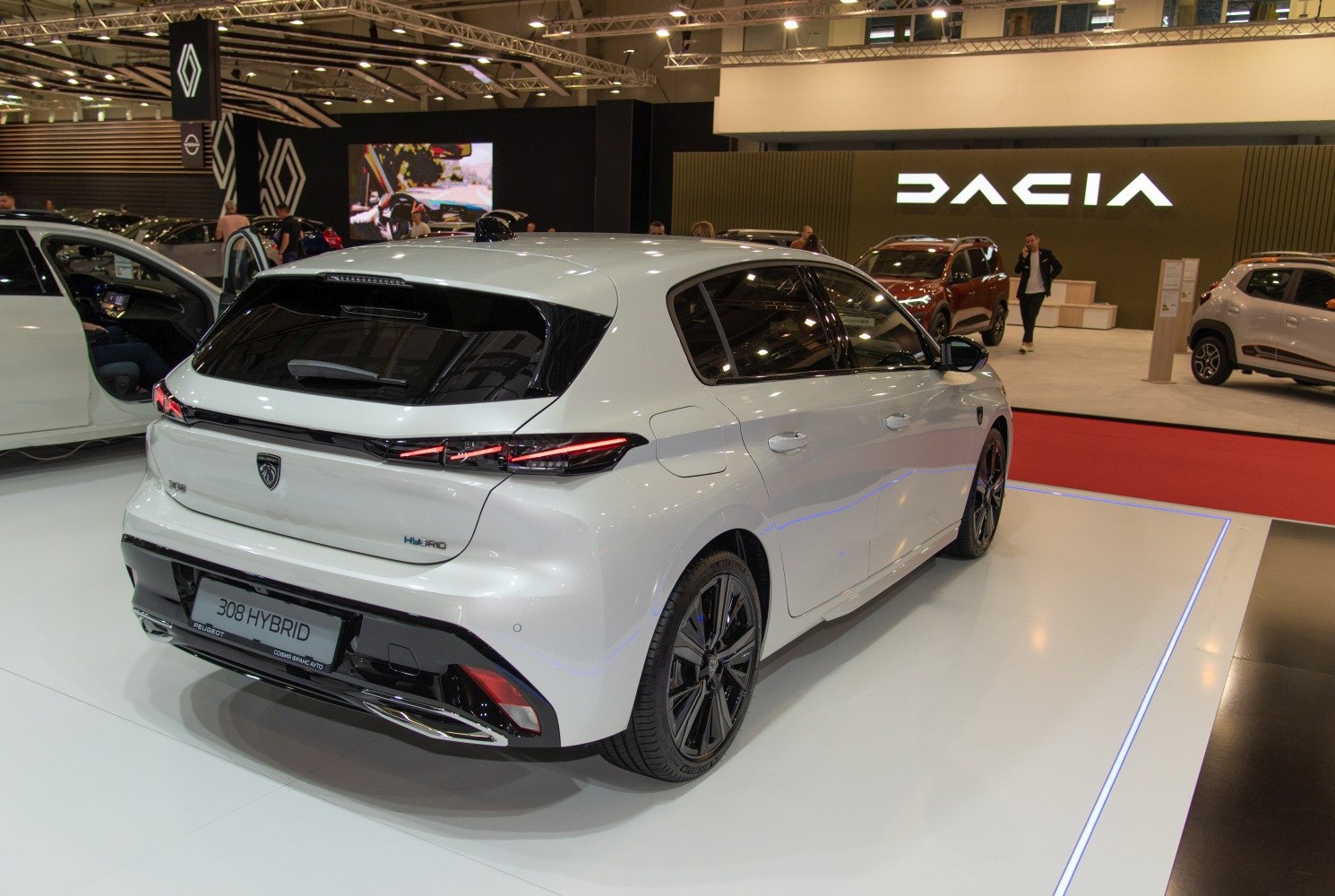 Rear view of a modern hybrid hatchback with distinctive LED taillights