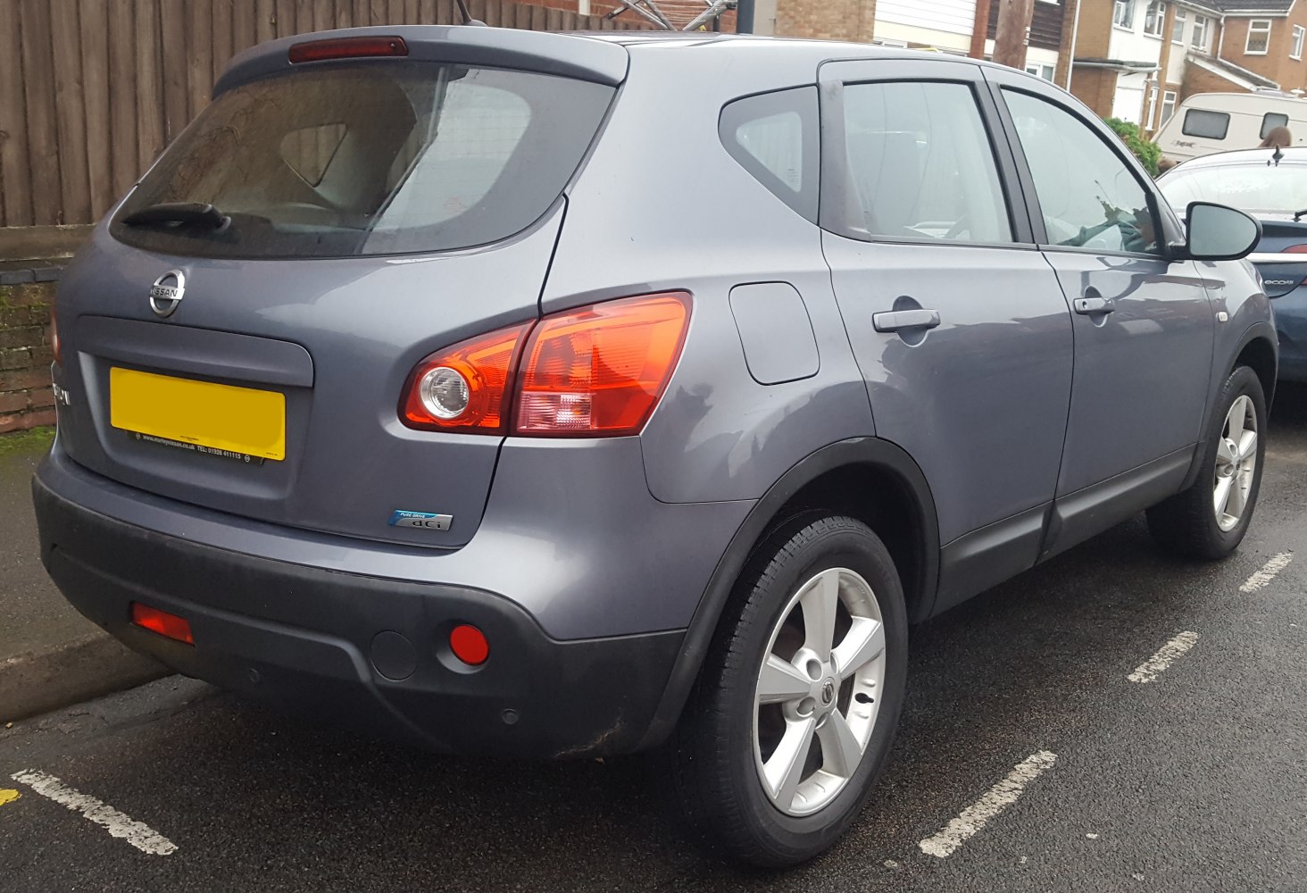 Rear view with taillights and alloy wheels of a compact SUV