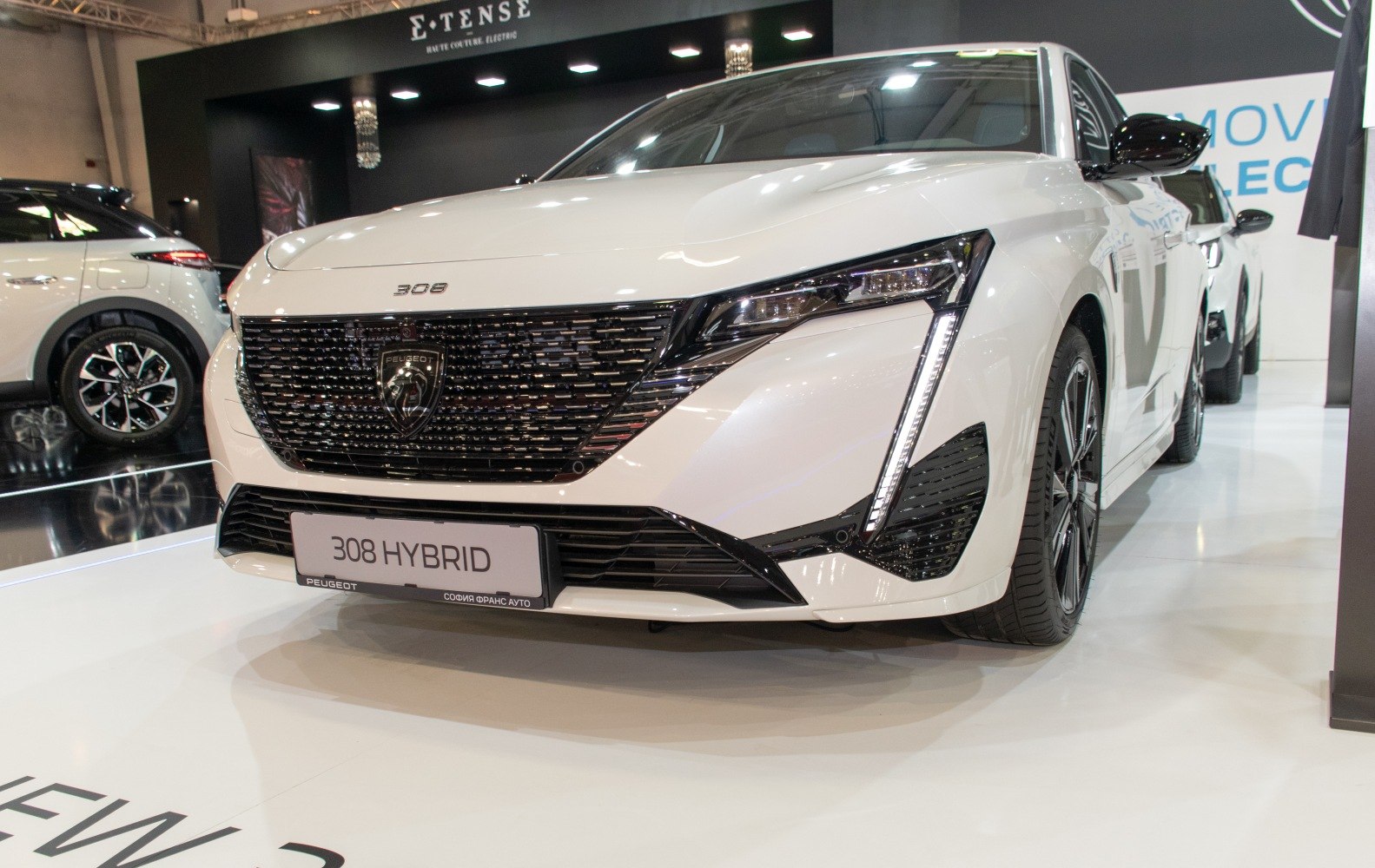 Hybrid sedan front grille with distinctive LED headlights