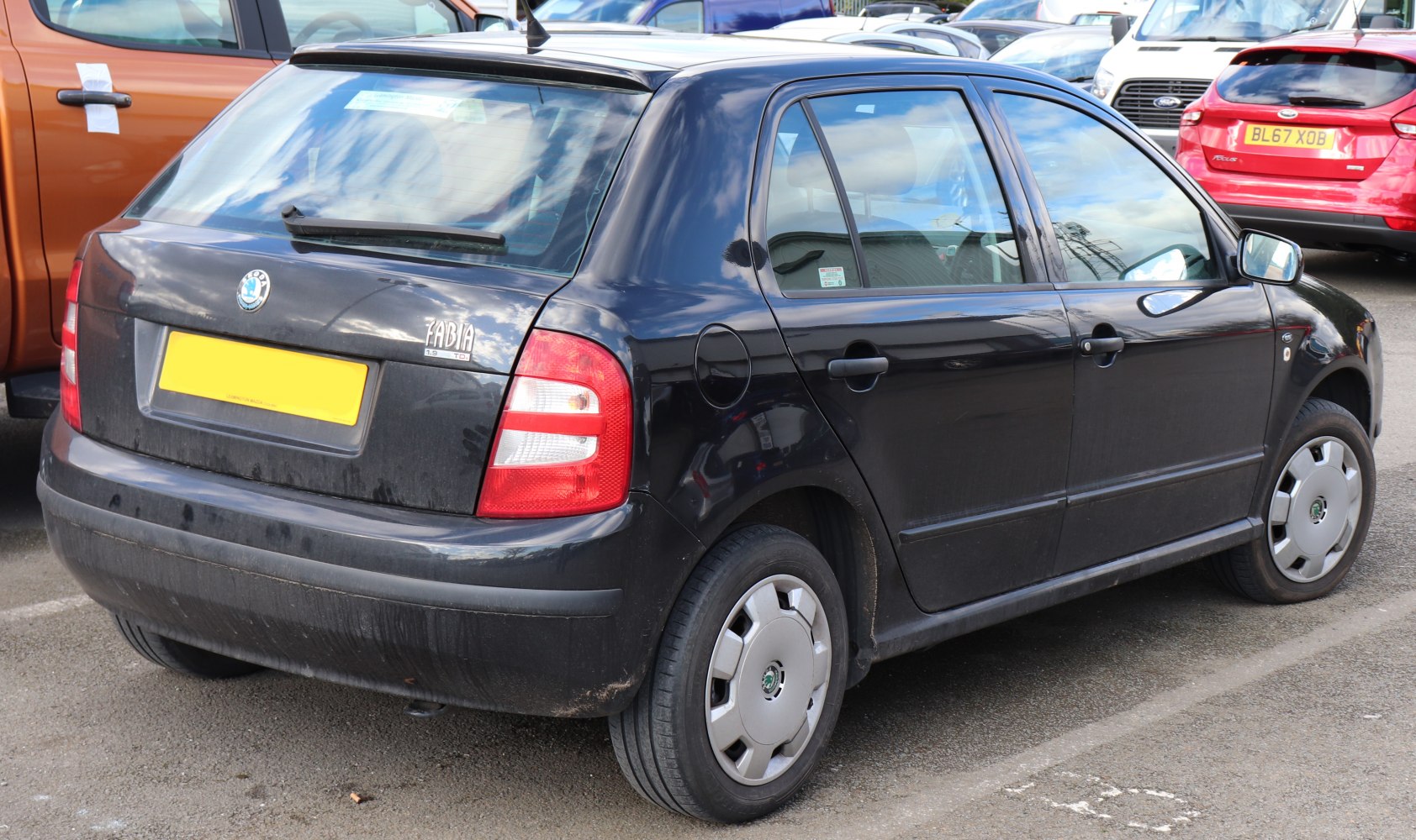 Rear hatchback view with taillights and badge.
