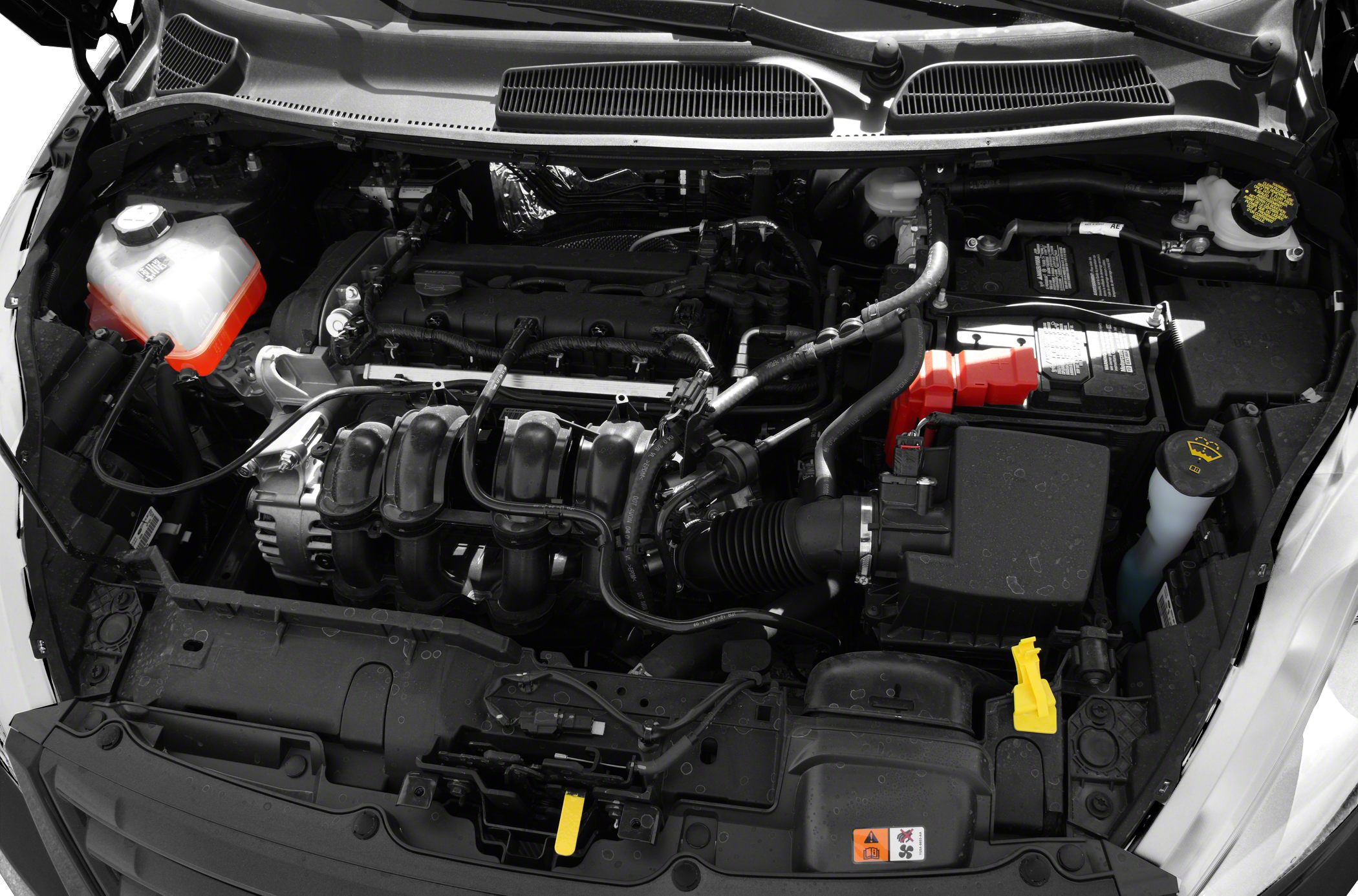 Engine bay with visible battery, coolant reservoir, and engine components.