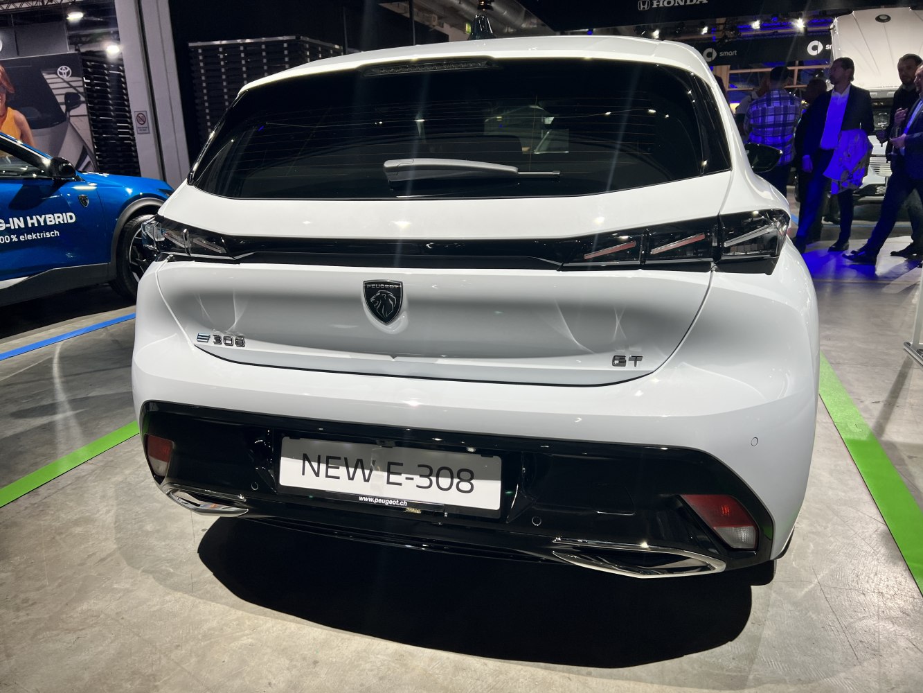Rear hatchback view with LED tail lights and GT badge.