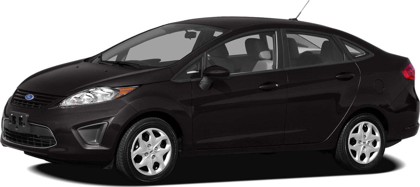 Side profile of black compact sedan with headlights and alloy wheels