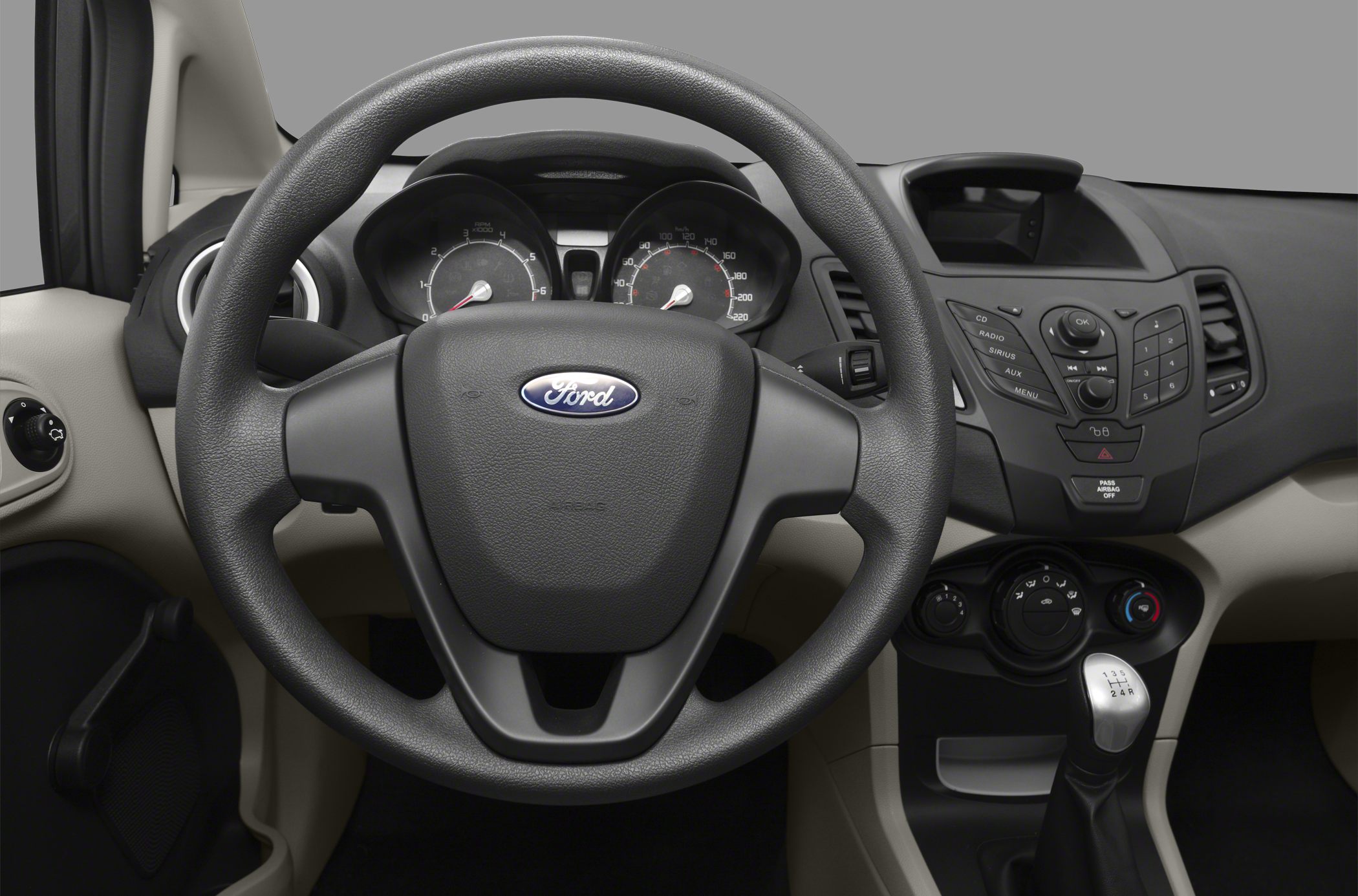 Dashboard, steering wheel, and manual gear shift interior view