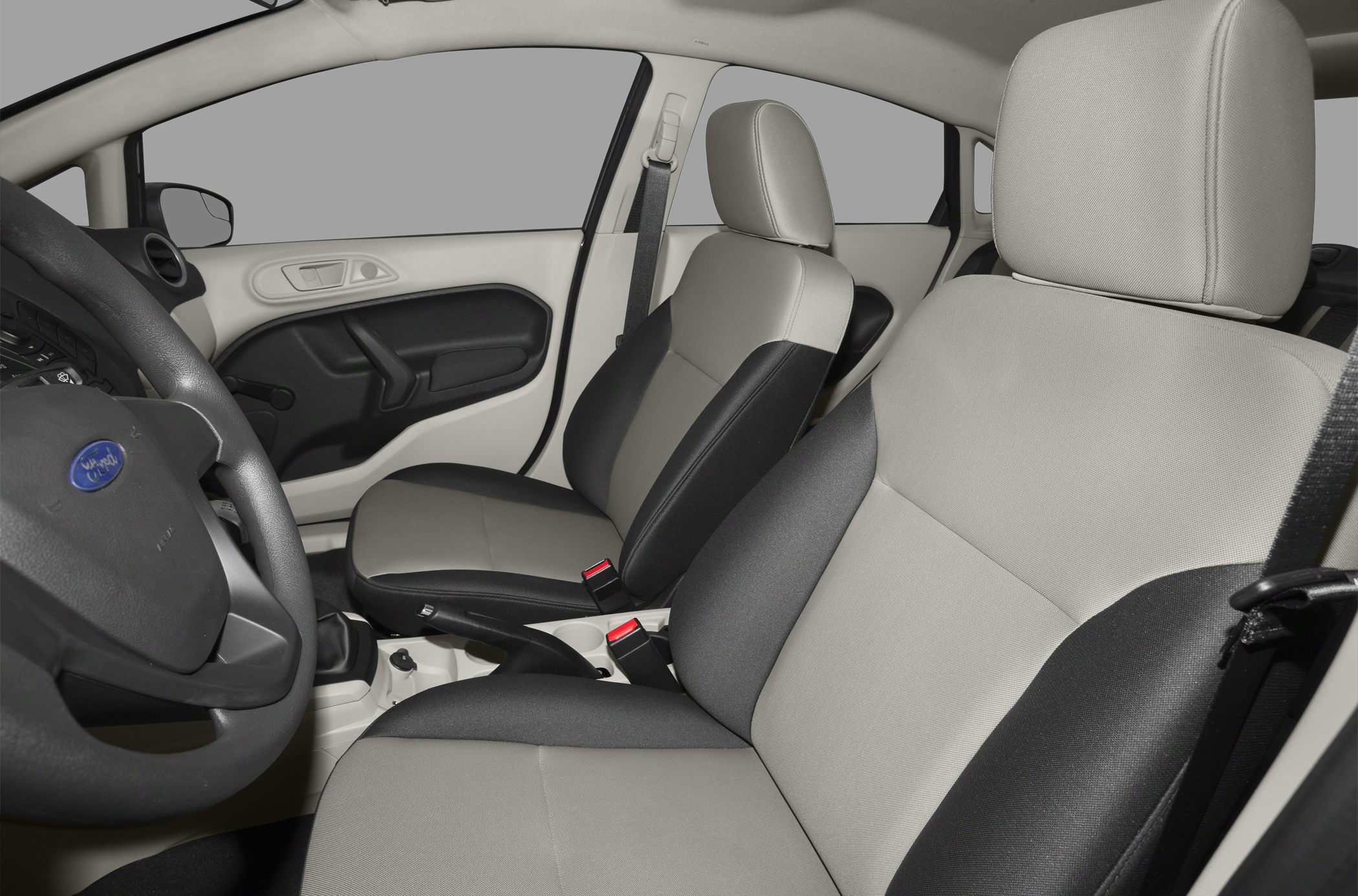 Two-tone front seats and door panel of a compact car interior