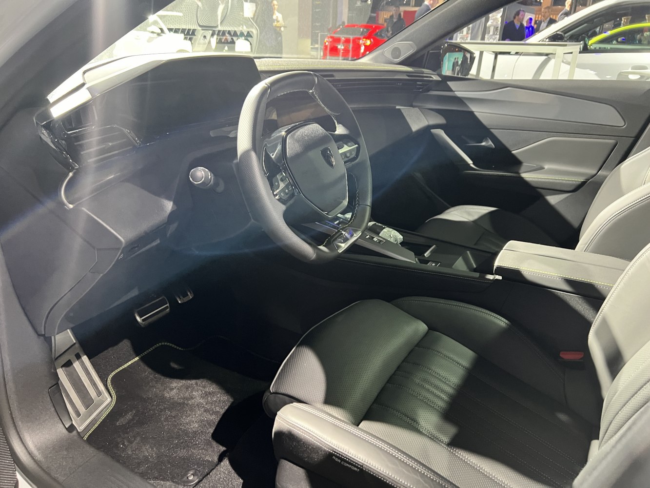 Modern digital cockpit and sleek steering wheel with premium seats