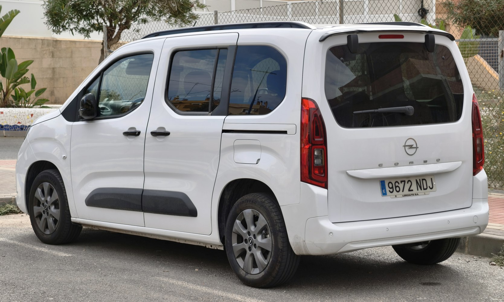 Rear and side profile with tail lights and sliding door