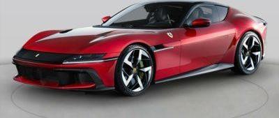 Red sports coupe with aerodynamic body and sharp front fascia