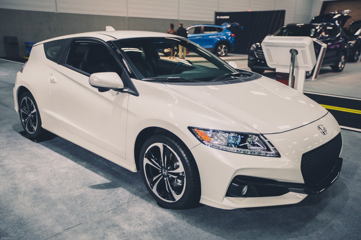 Front side view with sleek front end and sporty alloy wheels