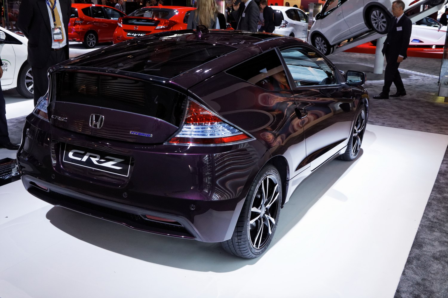 Sporty hatchback rear view with hybrid badge and unique taillights