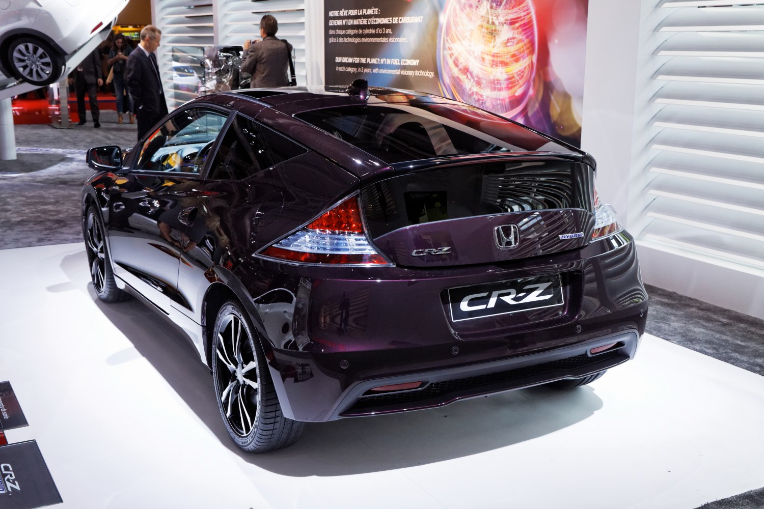 Sleek black hatchback rear with sporty wheels and distinctive taillights