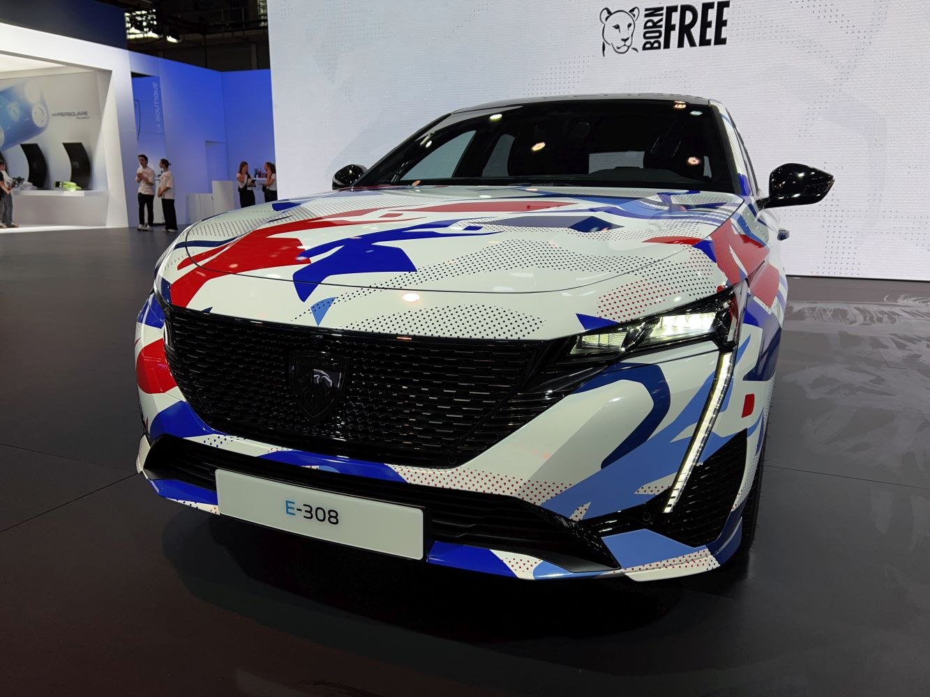 Front view of car with artistic wrap and LED headlights
