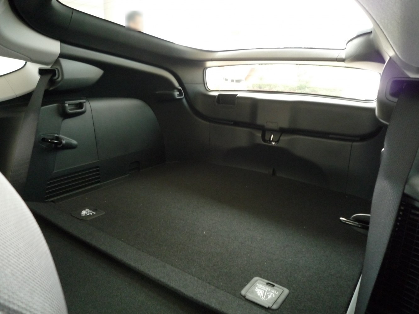 Rear cargo area with clear window and storage compartments