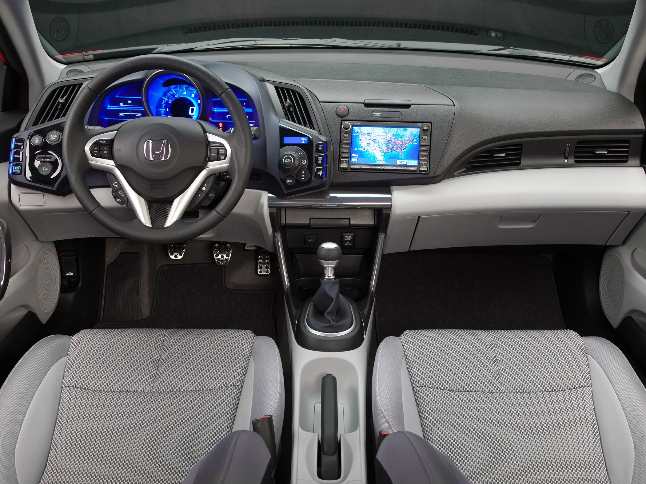 Digital dashboard, touchscreen navigation, manual gear stick
