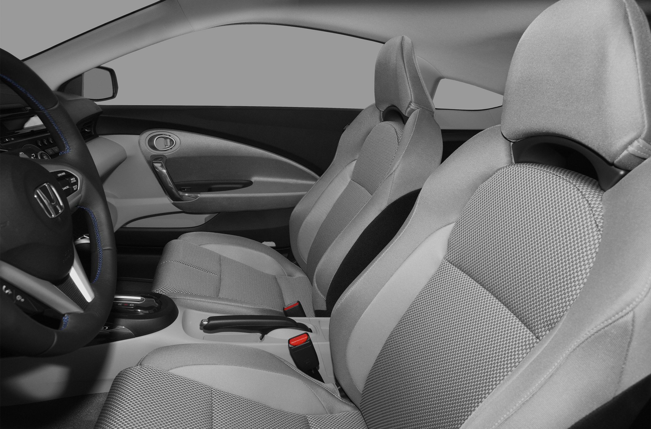 Sporty bucket seats and ergonomic dashboard in compact cabin