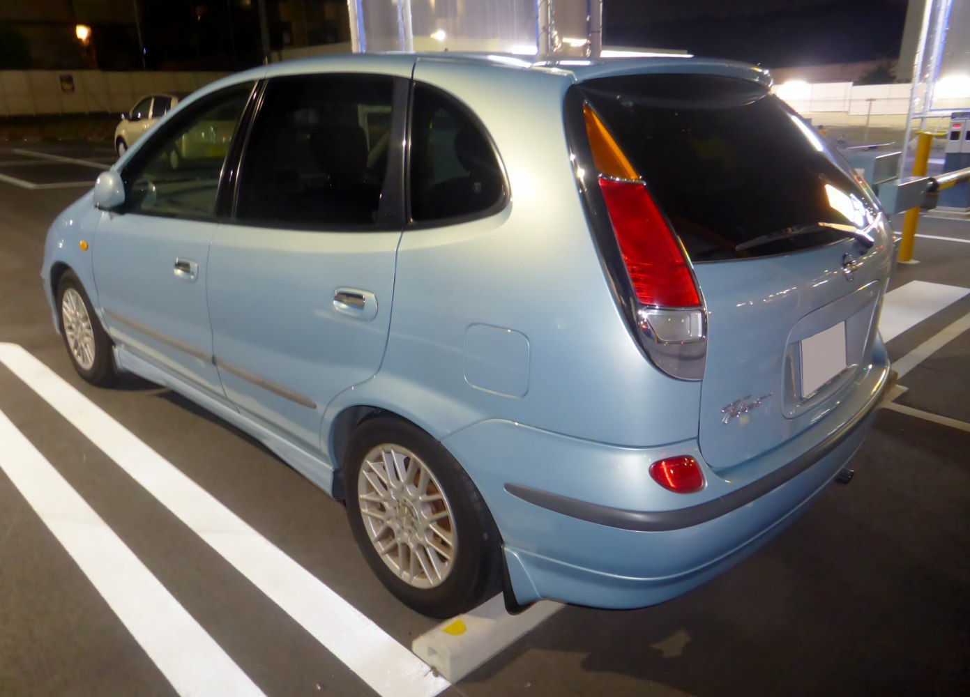 Rear and side view of a five-door hatchback with vertical tail lights