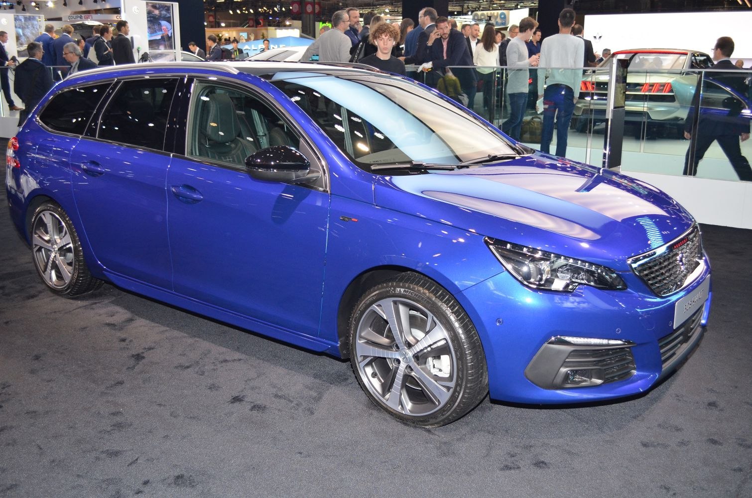 Blue mid-size hatchback with LED headlights and alloy wheels