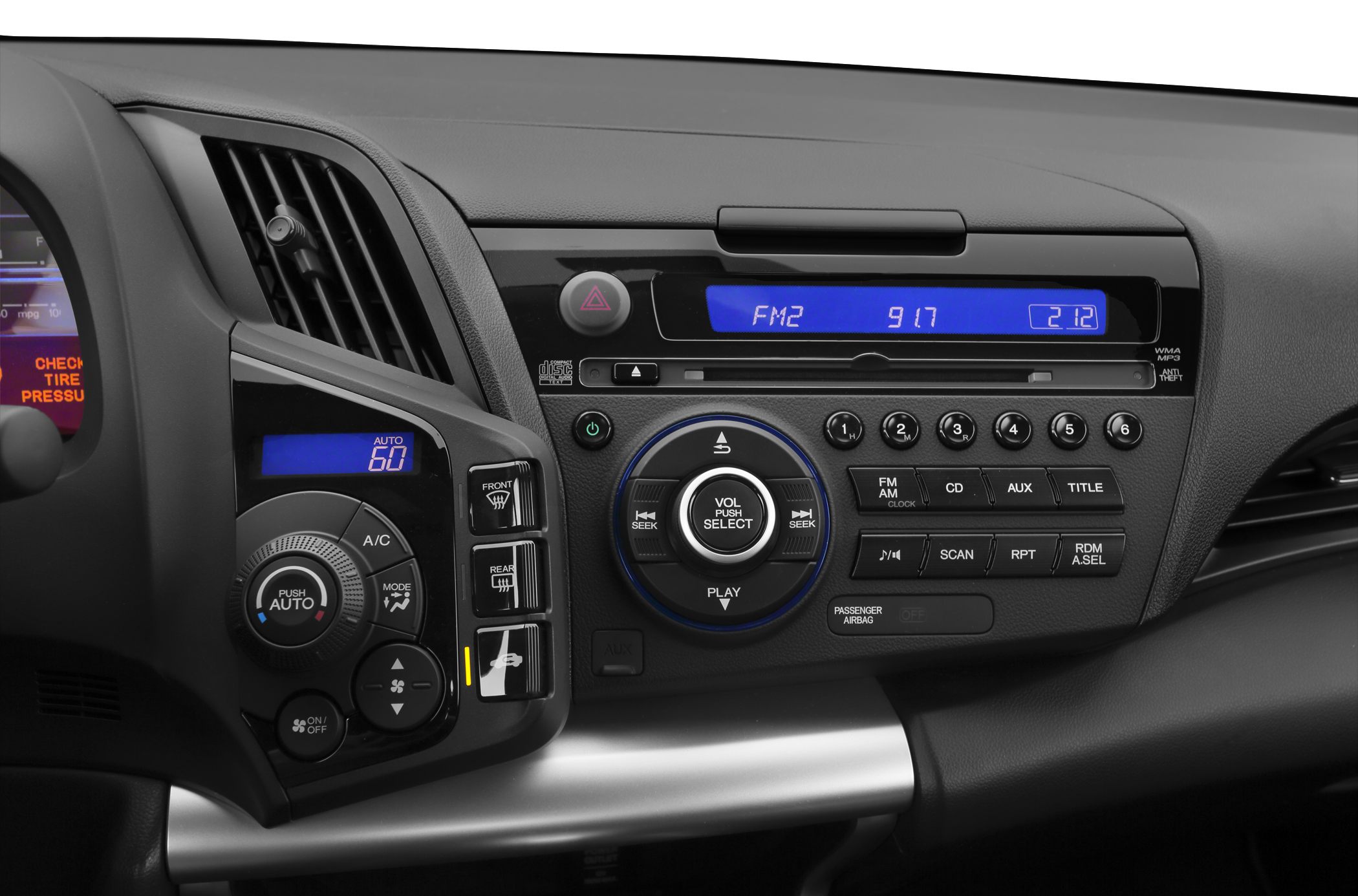 Center console audio system and HVAC climate control with digital displays and buttons.