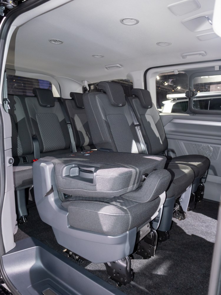 Multi-row seating with foldable seats inside spacious van interior