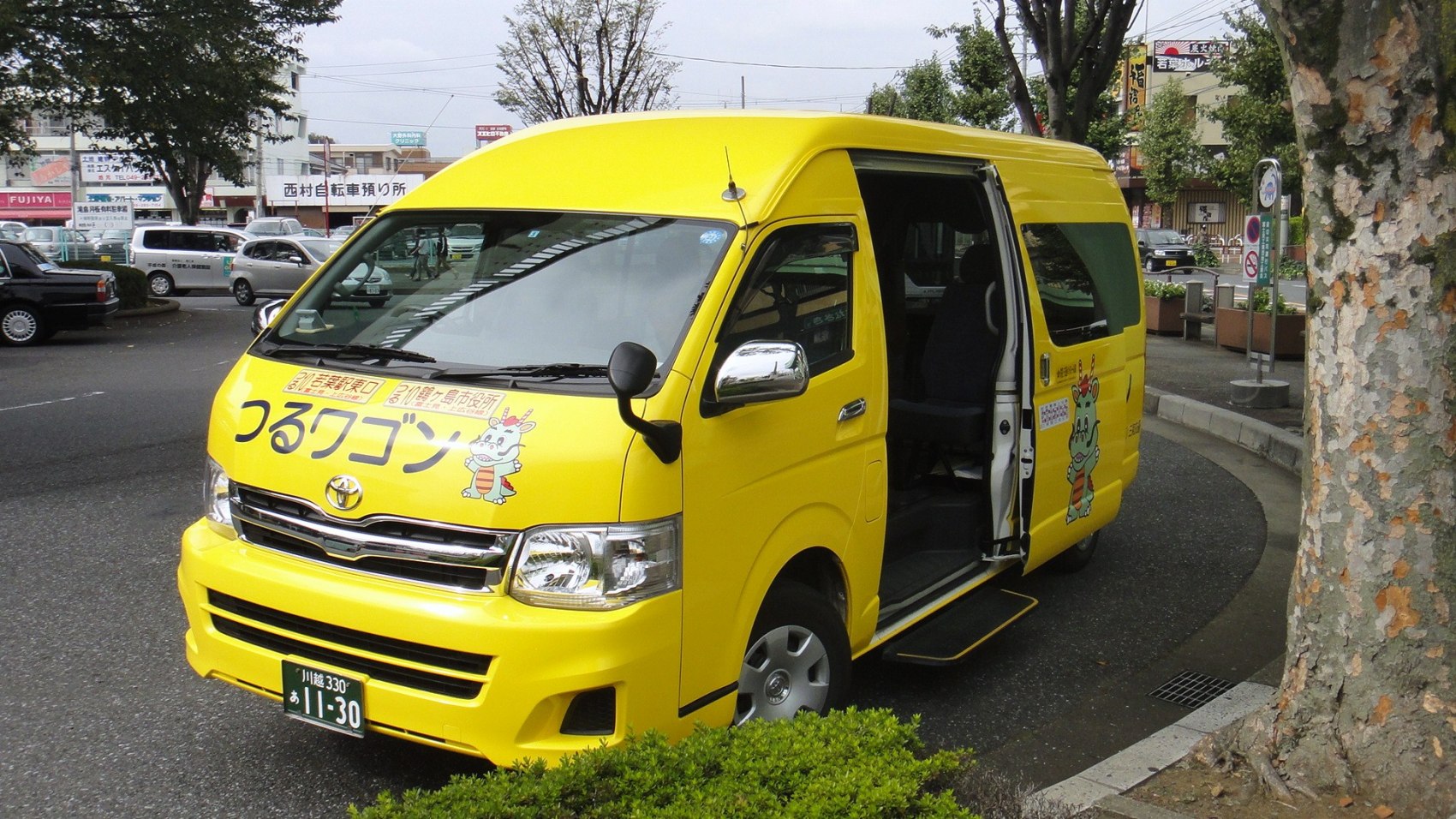 Yellow long van with sliding side door open