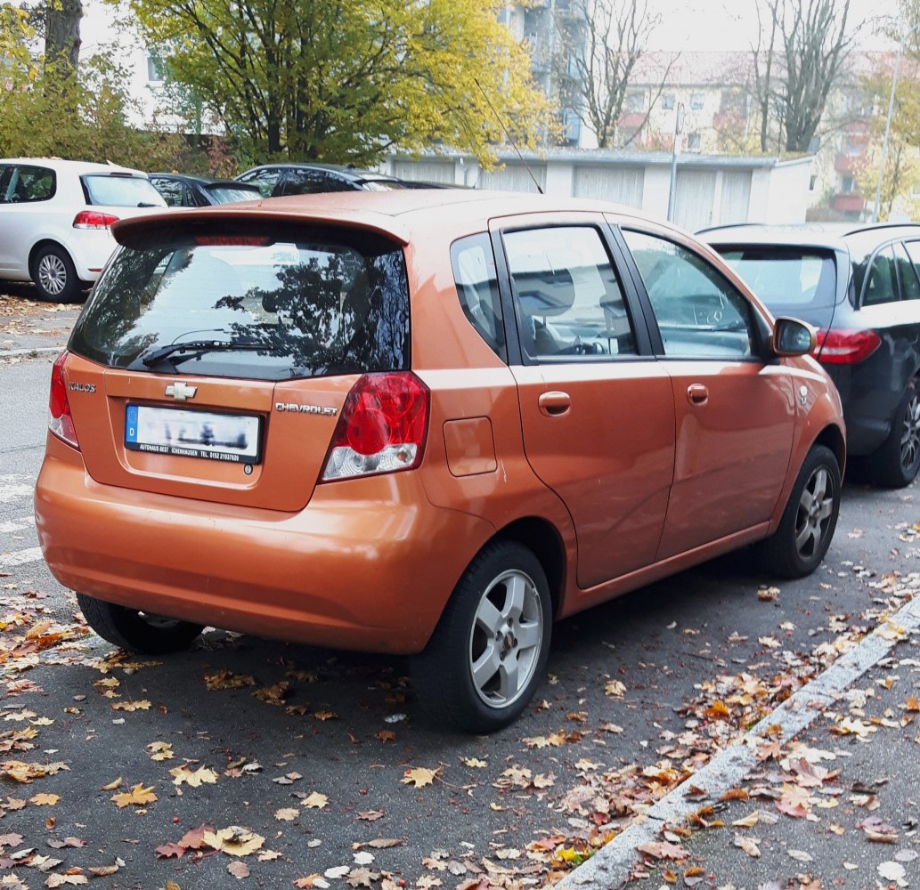 Rear and side view of a compact 5-door hatchback showing distinctive rear lights and fuel cap.